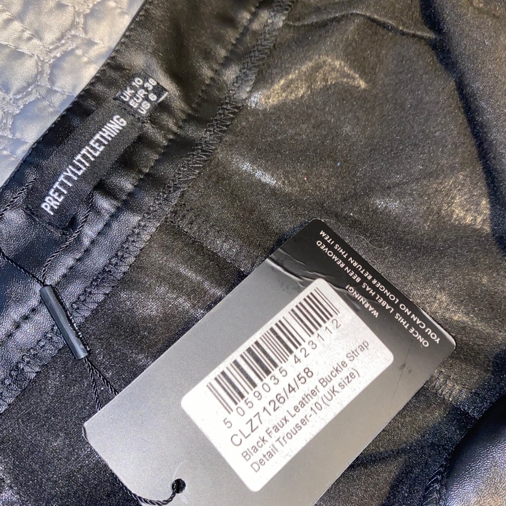black faux leather buckle pant